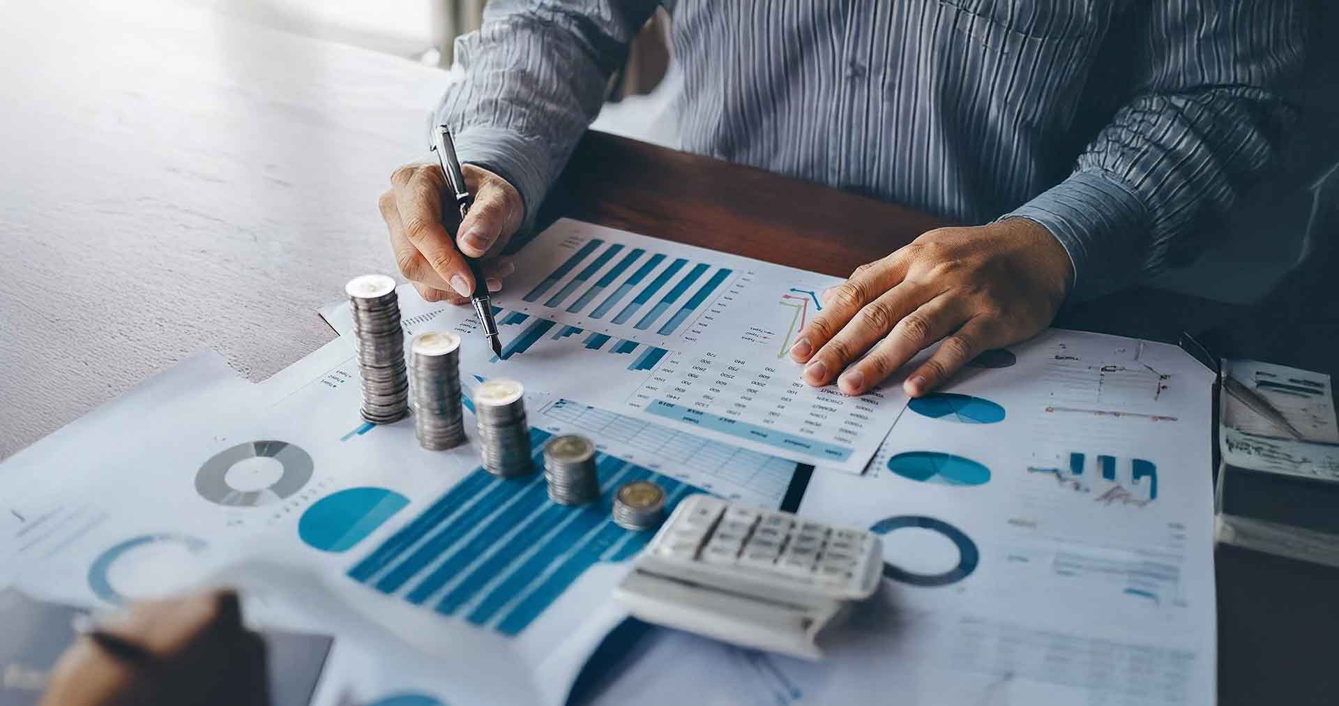 Businessman Accountant Counting Money And Making Notes At Report